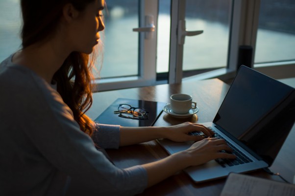 Woman using a laptop at a desk